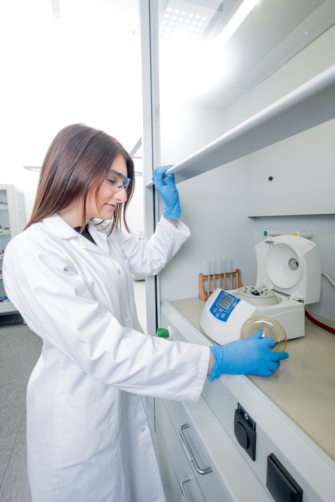 Laboratory scientist using compact Sigma 1-14 microcentrifuge
