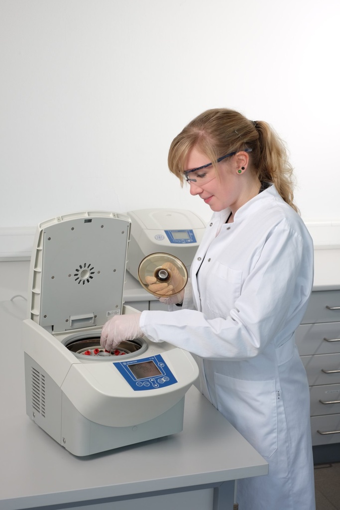 Lab scientist using Sigma 1-16 microcentrifuge
