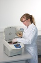 Lab scientist using Sigma 1-16 microcentrifuge
