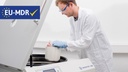 Lab technician loading blood bags into Sigma 8KBS, MD, package, floorstanding refrigerated centrifuge